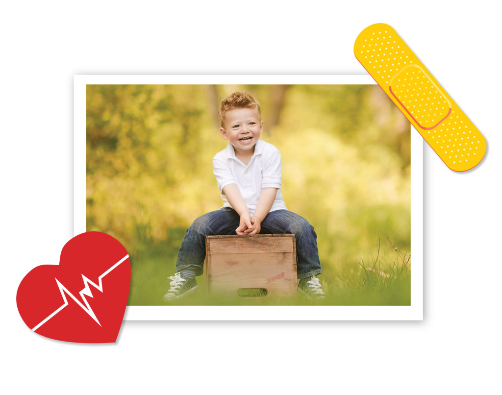 Boy smiling with heart and band-aid 